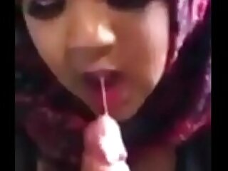 Muslim woman in hijab giving blowjob